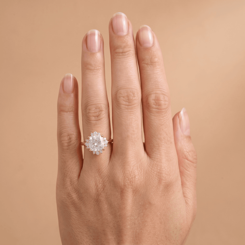 Cushion diamond ring on model's hand outdoor