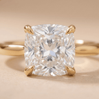 Cathedral setting cushion engagement ring close-up