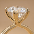 Close-up of cushion cut moissanite in dual prong setting