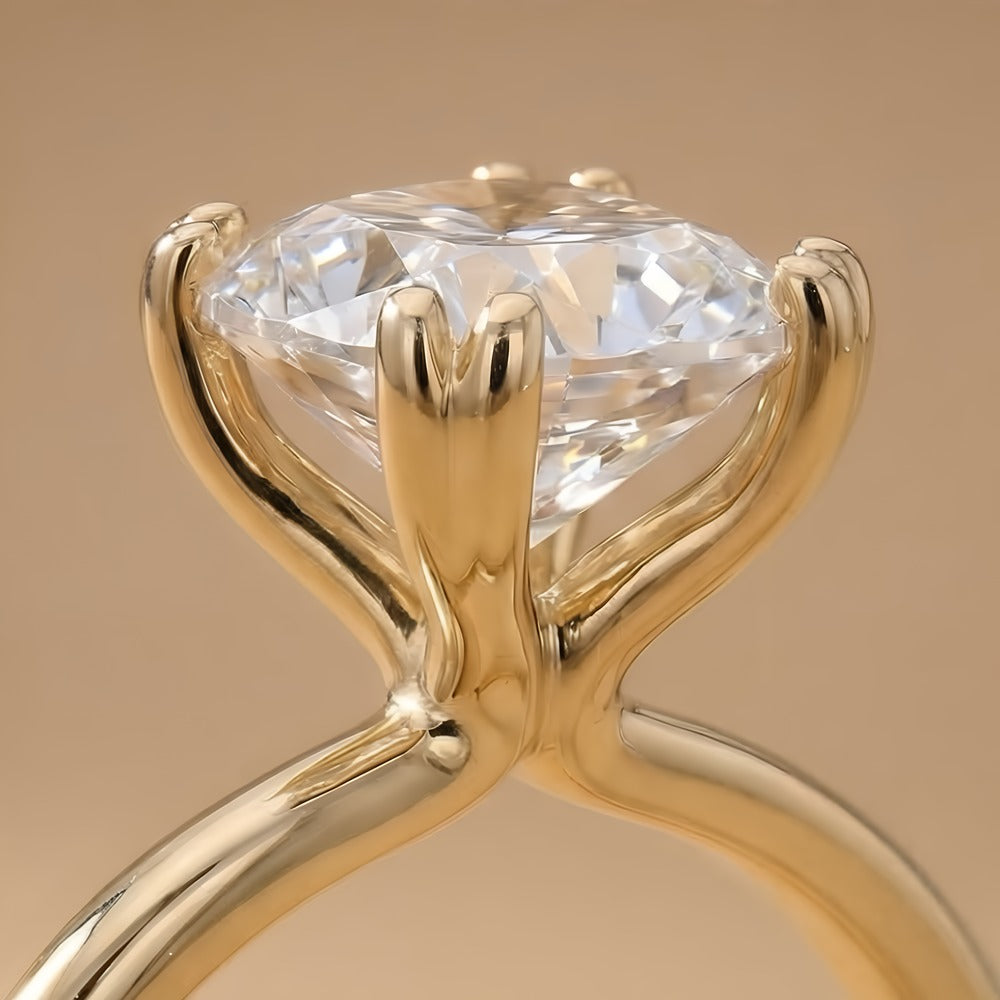 Close-up of cushion cut moissanite in dual prong setting