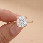 Cushion moissanite dual prong ring on model's hand
