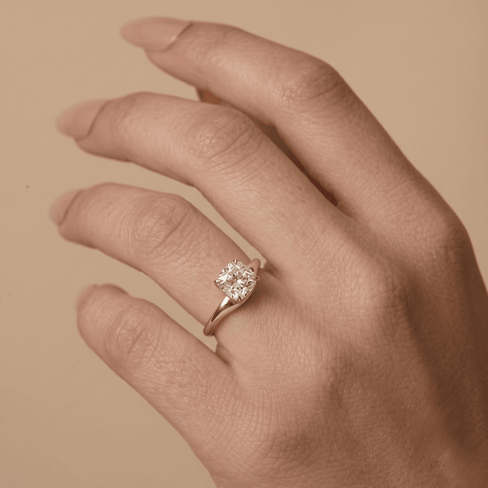 Moissanite solitaire proposal ring worn on hand finger