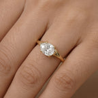 14K rose gold curved band with east-west pear moissanite