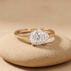 East-west pear moissanite engagement ring with 14K curved band