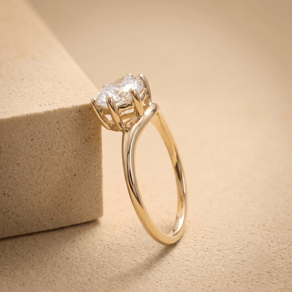 Ethically sourced pear moissanite ring in 14K yellow gold