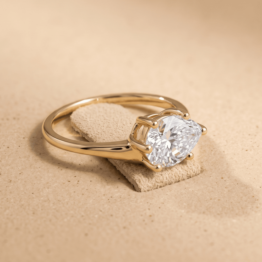 Close-up of pear moissanite set in horizontal east-west style