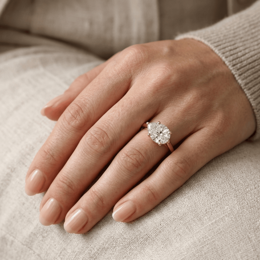 Pear moissanite anniversary ring with 14K curved band