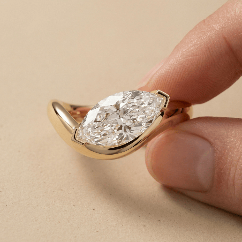 18KT gold east west marquise diamond engagement ring