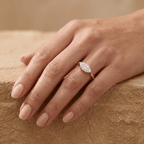 Curved 14K band East West marquise ring on hand