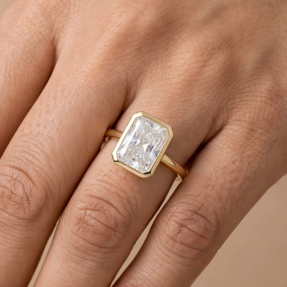 Classic bezel set radiant cut moissanite ring