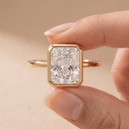 Radiant moissanite engagement ring worn on hand