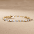 Emerald and oval diamond tennis bracelet