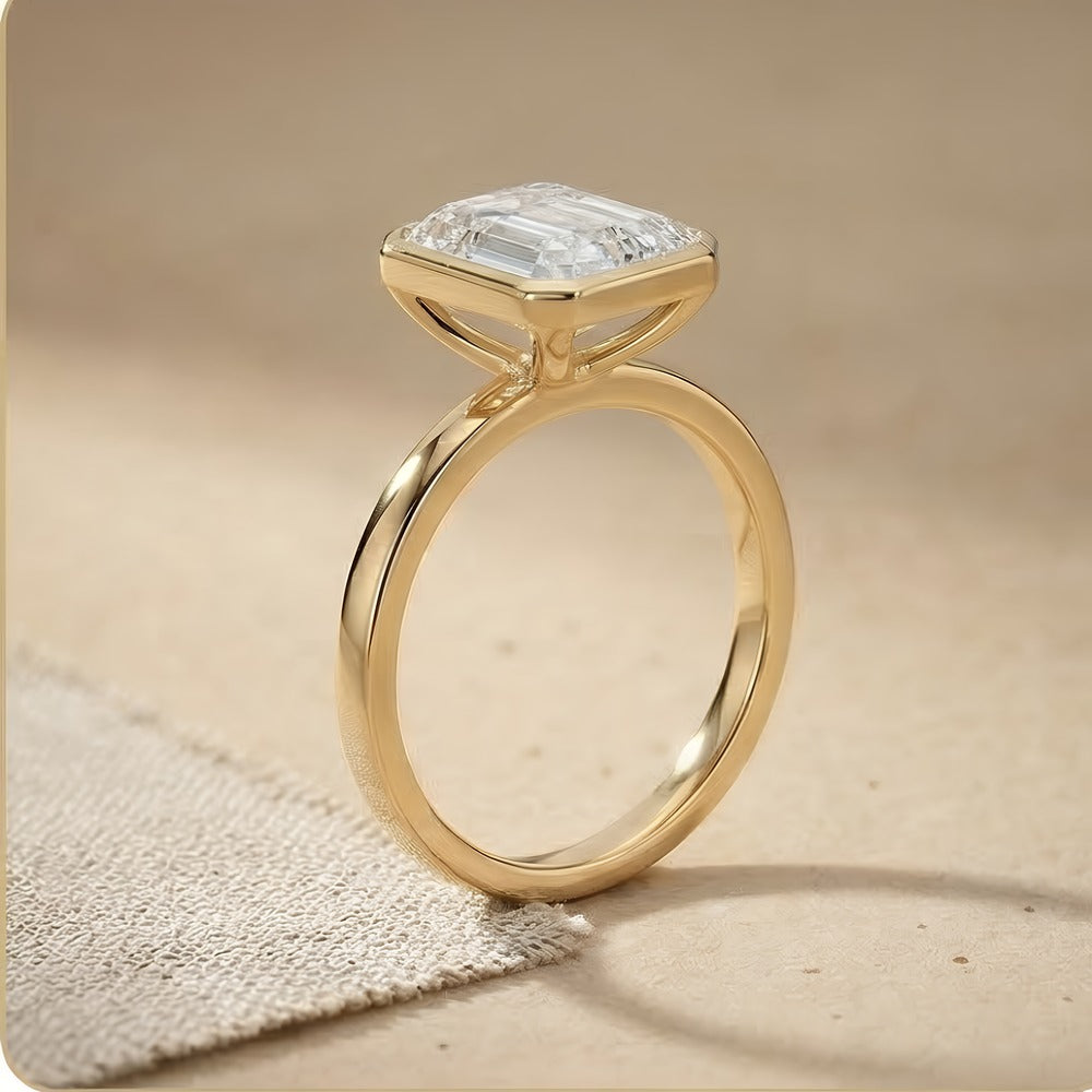 Bezel set emerald lab grown diamond ring side profile