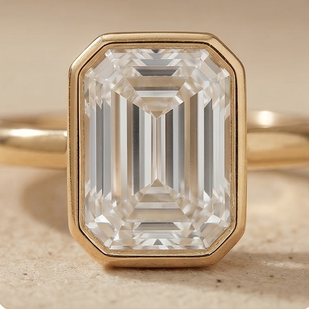 Emerald cut diamond ring in sleek bezel setting close up
