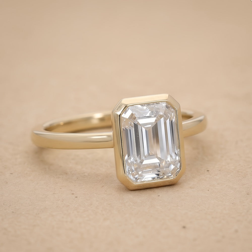 Bezel set emerald lab grown diamond ring side profile