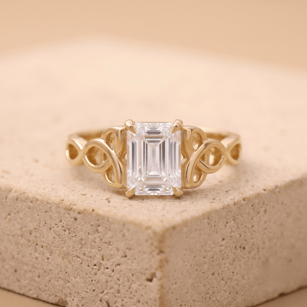 Emerald Celtic engagement ring with moissanite center stone