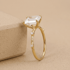 Emerald cut lab diamond solitaire with slim gold band