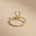 Emerald moissanite solitaire ring with delicate gold band