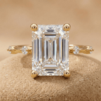 Close-up of emerald cut moissanite gold engagement ring