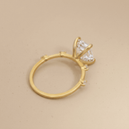 Close-up of emerald cut moissanite gold engagement ring