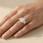 Elegant gold engagement ring with emerald cut lab diamond