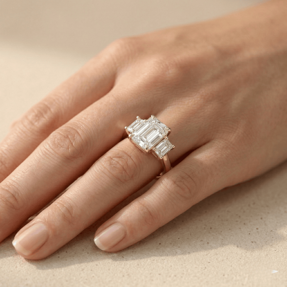 Elegant gold engagement ring with emerald cut lab diamond