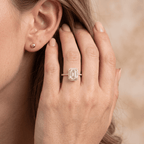 Emerald cut halo ring on model's hand