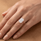 Ethically sourced emerald cut solitaire ring on ring finger
