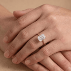 Emerald moissanite solitaire ring close-up on hand Finger
