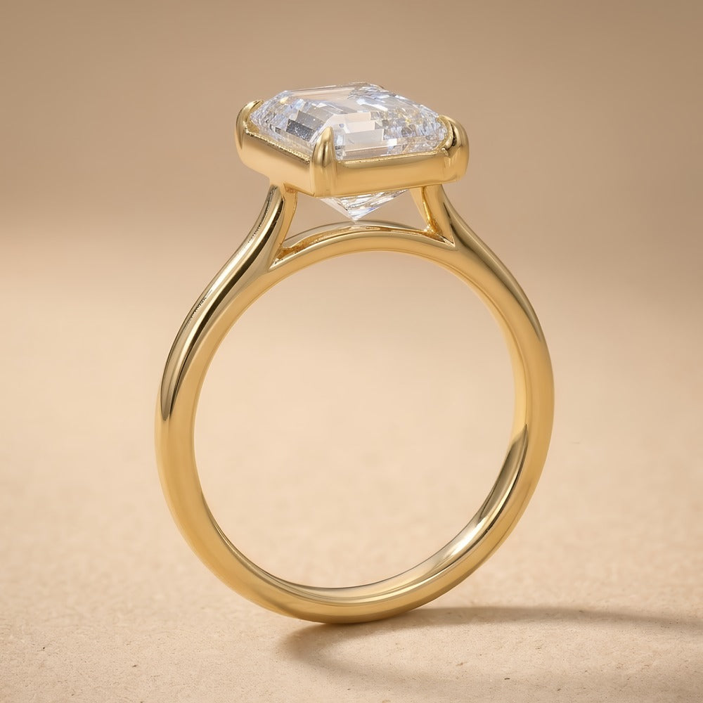 Emerald cut moissanite solitaire ring in 14K gold