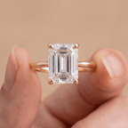 14K gold wedding ring with emerald cut moissanite