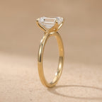 14K emerald moissanite promise ring on white background