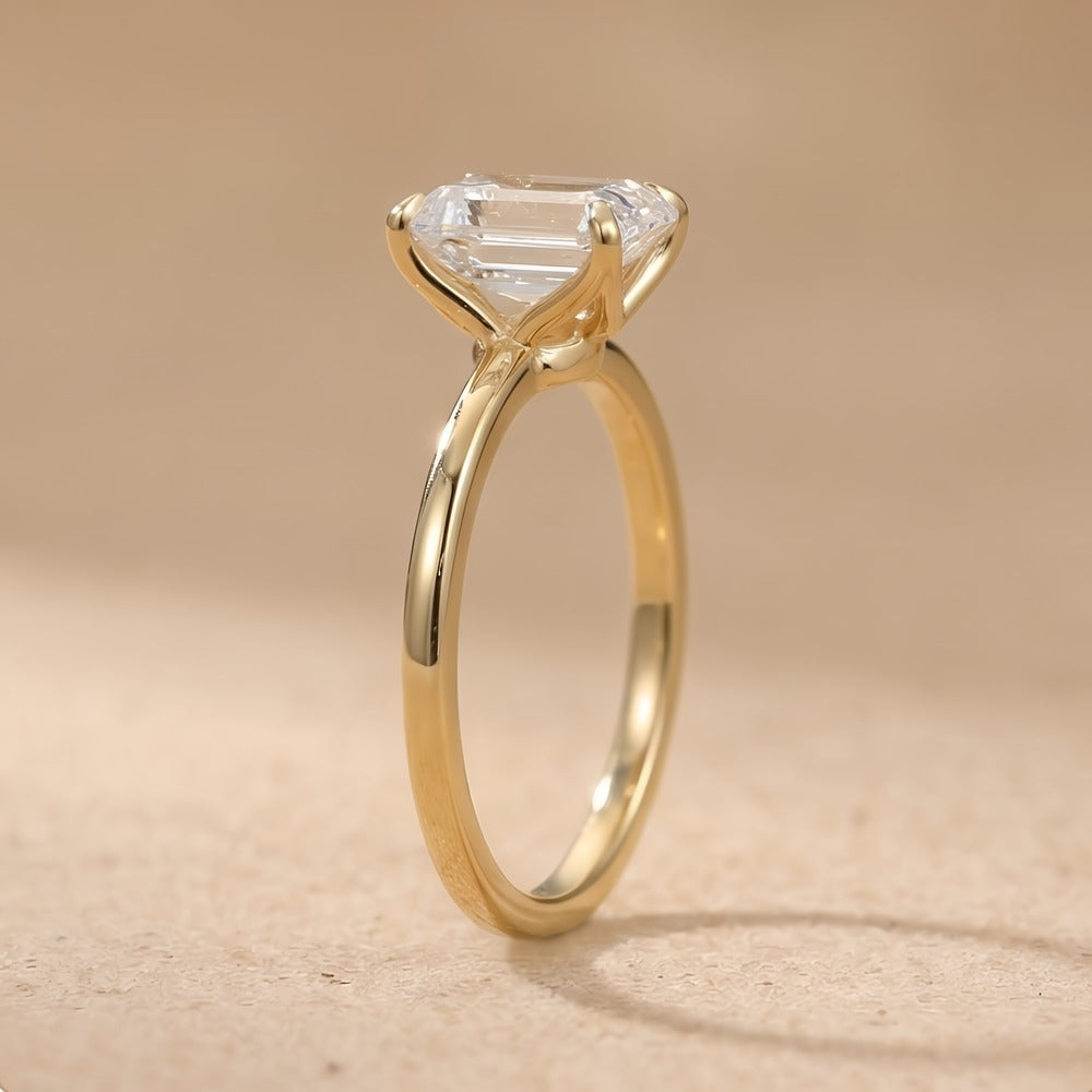 14K emerald moissanite promise ring on white background