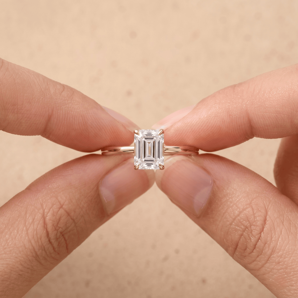 Emerald moissanite promise ring side profile on model hand
