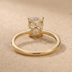 Dainty emerald moissanite ring top angle view