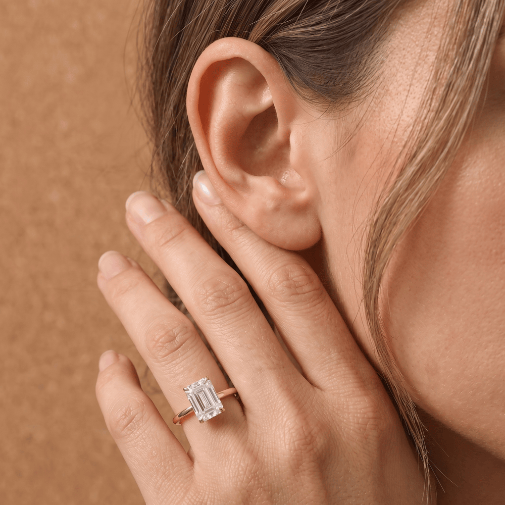 Emerald moissanite promise ring worn on finger lifestyle shot