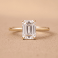 Emerald moissanite engagement ring in 14K dainty band