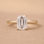 Emerald moissanite engagement ring in 14K dainty band
