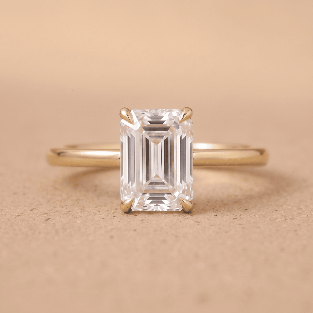 Emerald moissanite engagement ring in 14K dainty band