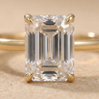 Emerald moissanite promise ring diamond accent close-up