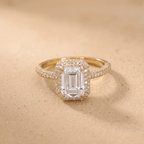 Petite halo engagement ring, emerald cut center stone