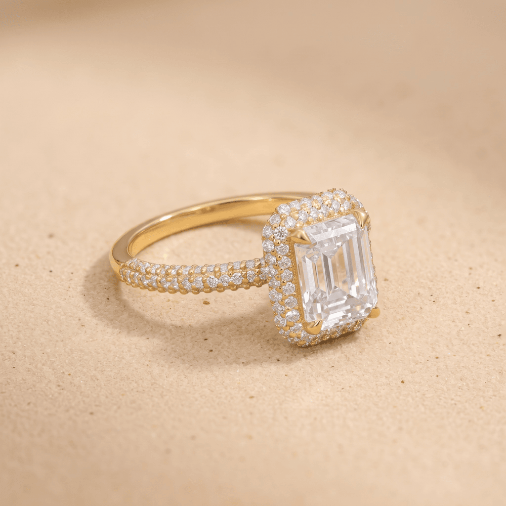Emerald moissanite ring with diamond halo, side angle