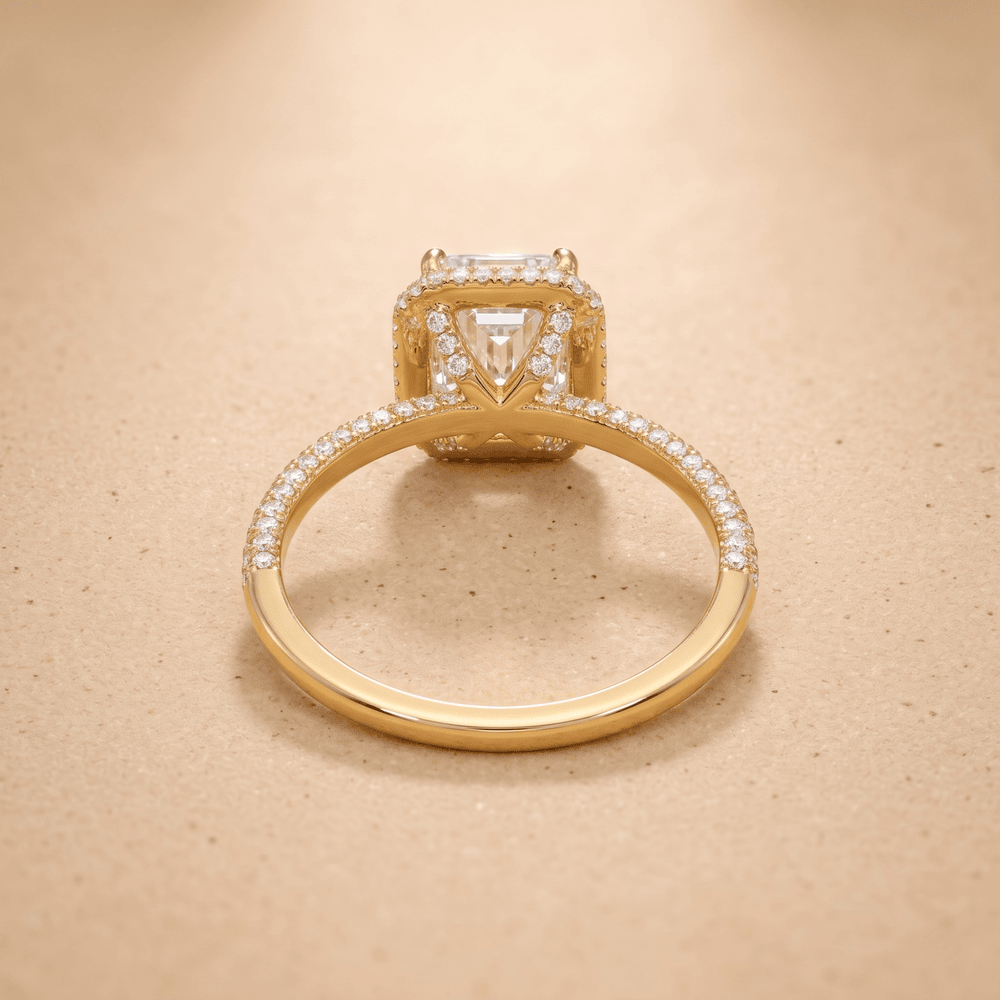 Emerald moissanite ring with diamond halo, side angle