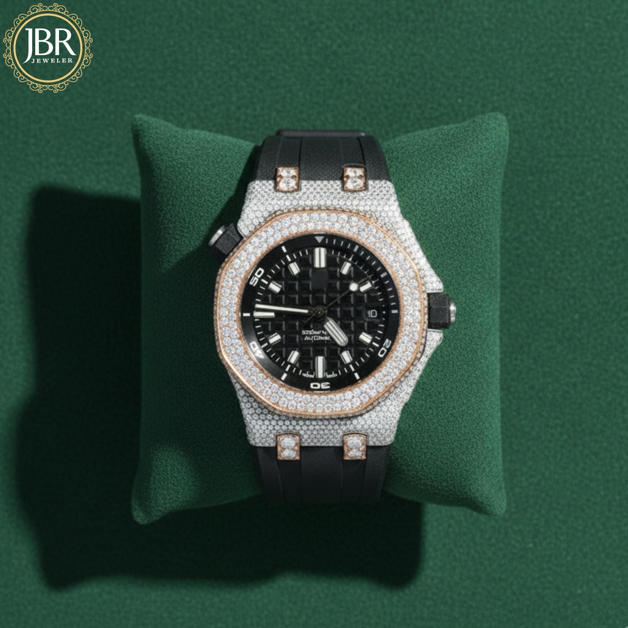 Luxury diamond-encrusted watch on a green cushion with JBR Jewels logo.