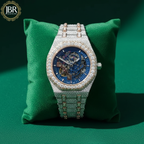 Fully studded iced out blue skeleton bust down watch with transparent dial, sparkling stones, and bold luxury statement design.