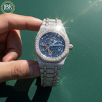 Fully studded iced out blue skeleton bust down watch with transparent dial, sparkling stones, and bold luxury statement design.