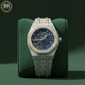 Fully studded iced out blue skeleton bust down watch with transparent dial, sparkling stones, and bold luxury statement design.