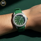 Green watch with diamond-studded bezel on a wrist against a green background, featuring JBR Jewellers 