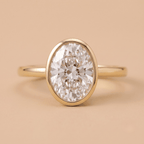 Oval bezel set diamond proposal ring front view