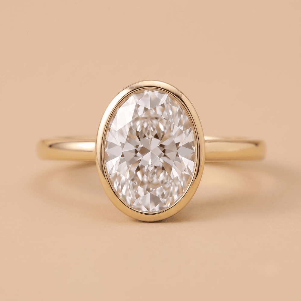 Oval bezel set diamond proposal ring front view